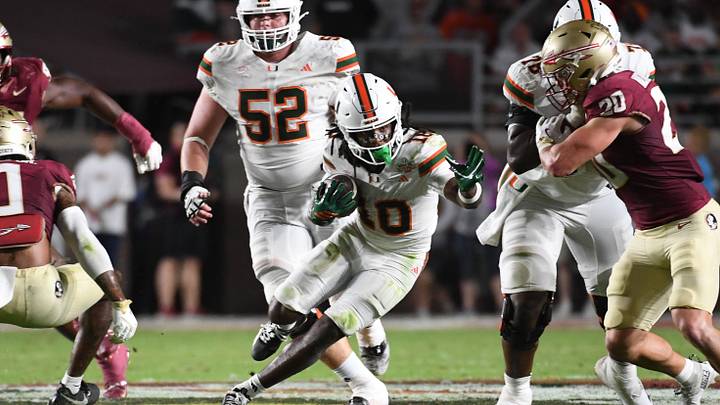 Oct 4, 2025; Tallahassee, Florida, USA; Miami Hurricanes wide receiver Malachi Toney (10) runs against Florida State Seminoles linebacker Blake Nichelson (20) during the second half at Doak S. Campbell Stadium. Mandatory Credit: Robert Myers-Imagn Images