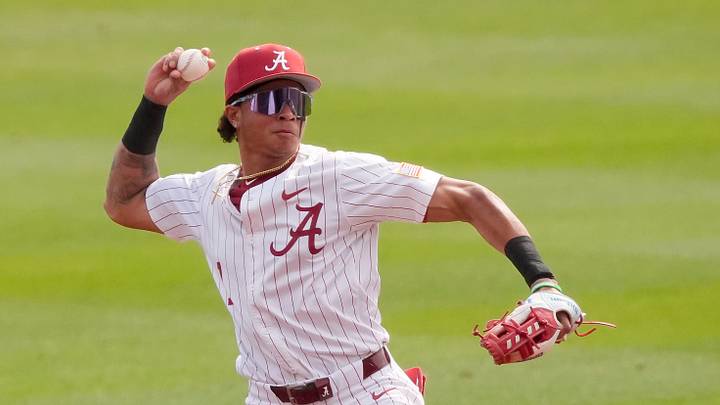 Feb 14, 2026; Tuscaloosa, AL, USA; Alabama shortstop Justin Lebron (1) fields a ground ball and throws to first for an out as the Crimson Tide played Washington State at Sewell-Thomas Stadium. Alabama played a double header against Washington State Saturday to escape Sunday’s forecast rain.