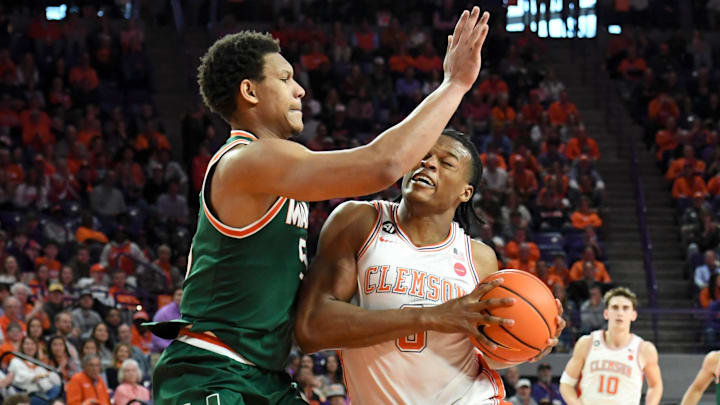 Miami Hurricanes forward Malik Reneau (5) defends Clemson Tigers forward RJ Godfrey (0) Saturday, Jan. 17, 2026, during the NCAA men’s basketball game at Littlejohn Coliseum in Clemson, South Carolina.