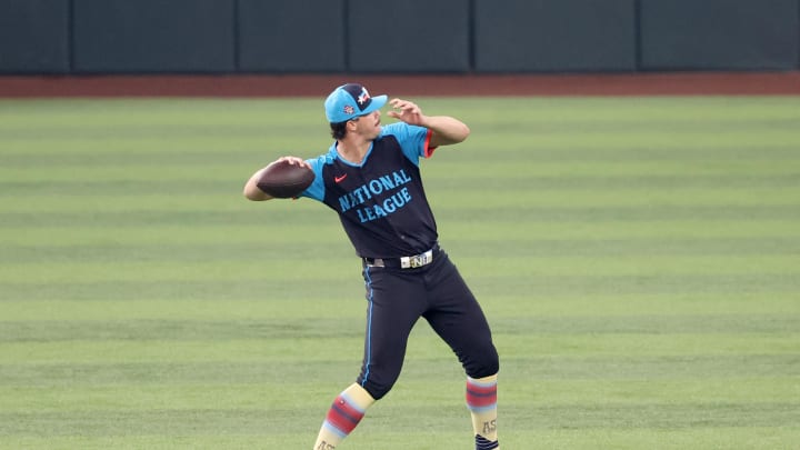 National League pitcher Paul Skenes of the Pittsburgh Pirates (30) warms up with a football before the 2024 MLB All-Star game at Globe Life Field on July 16.