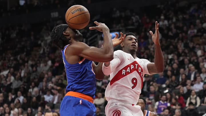 Dec 9, 2024; Toronto, Ontario, CAN; New York Knicks forward Precious Achiuwa (5) takes a rebound off his face while Toronto Raptors guard RJ Barrett (9) looks on during the first half at Scotiabank Arena. Mandatory Credit: John E. Sokolowski-Imagn Images Dec 9, 2024; Toronto, Ontario, CAN; New York Knicks forward Precious Achiuwa (5) takes a rebound off his face while Toronto Raptors guard RJ Barrett (9) looks on during the first half at Scotiabank Arena. Mandatory Credit: John E. Sokolowski-Imagn Images