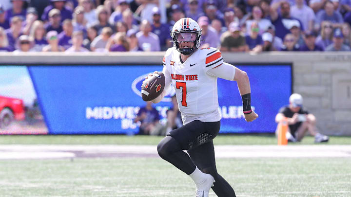 Sep 28, 2024; Manhattan, Kansas, USA; Oklahoma State Cowboys quarterback Alan Bowman (7) scrambles against the Kansas State Wildcats during the second quarter at Bill Snyder Family Football Stadium. Mandatory Credit: Scott Sewell-Imagn Images