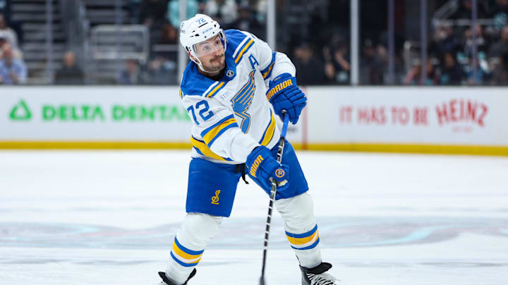 Mar 4, 2026; Seattle, Washington, USA; St. Louis Blues defenseman Justin Faulk (72) attempts a shot on goal in the first period against the Seattle Kraken at Climate Pledge Arena. Mandatory Credit: Kevin Ng-Imagn Images