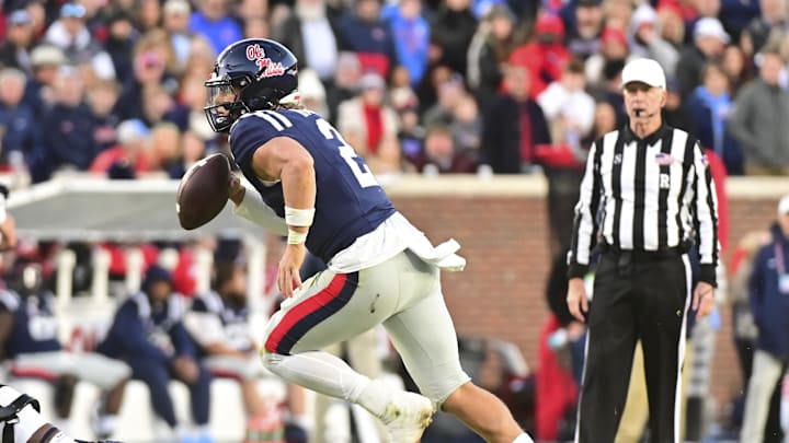 Nov 29, 2024; Oxford, Mississippi, USA; Mississippi Rebels quarterback Jaxson Dart (2) runs the ball against the Mississippi State Bulldogs during the second quarter at Vaught-Hemingway Stadium. Mandatory Credit: Matt Bush-Imagn Images Nov 29, 2024; Oxford, Mississippi, USA; Mississippi Rebels quarterback Jaxson Dart (2) runs the ball against the Mississippi State Bulldogs during the second quarter at Vaught-Hemingway Stadium. Mandatory Credit: Matt Bush-Imagn Images