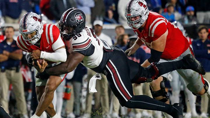Nov 1, 2025; Oxford, Mississippi, USA; South Carolina Gamecocks defensive lineman Gabriel Brownlow-Dindy (99) tackles Mississippi Rebels quarterback Trinidad Chambliss (6) during the fourth quarter at Vaught-Hemingway Stadium. Mandatory Credit: Petre Thomas-Imagn Images