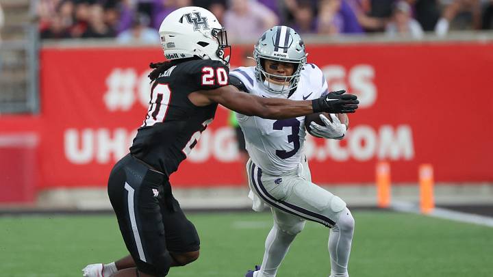 Nov 2, 2024; Houston, Texas, USA; Kansas State Wildcats running back Dylan Edwards (3) is tackled by Houston Cougars defensive back Jeremiah Wilson (20) in the first quarter at TDECU Stadium. Mandatory Credit: Thomas B. Shea-Imagn Images Nov 2, 2024; Houston, Texas, USA; Kansas State Wildcats running back Dylan Edwards (3) is tackled by Houston Cougars defensive back Jeremiah Wilson (20) in the first quarter at TDECU Stadium. Mandatory Credit: Thomas B. Shea-Imagn Images