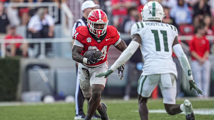 Nov 22, 2025; Athens, Georgia, USA; Georgia Bulldogs running back Bo Walker (24) runs against Charlotte 49ers defensive back Dwight Bootle II (11) during the second half at Sanford Stadium. Mandatory Credit: Dale Zanine-Imagn Images