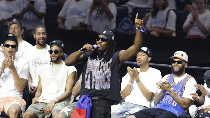 Jun 24, 2025; Oklahoma City, OK, USA; Oklahoma City Thunder guard Luguentz Dort (5) speaks to fans during the Champions Opening Ceremony for the parade inside the Paycom Center. Mandatory Credit: Alonzo Adams-Imagn Images