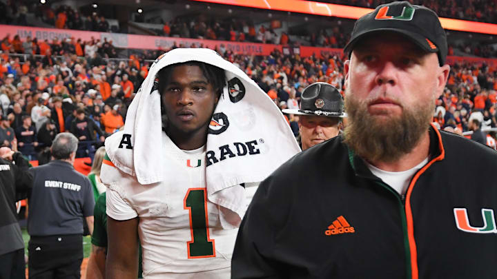 Nov 30, 2024; Syracuse, New York, USA; Miami Hurricanes quarterback Cam Ward (1) walks off the field following a game against the Syracuse Orange at the JMA Wireless Dome. Mandatory Credit: Rich Barnes-Imagn Images