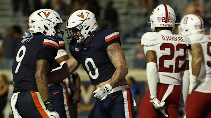 Sep 20, 2025; Charlottesville, Virginia, USA; Virginia Cavaliers tight end Sage Ennis (0) celebrates with Cavaliers tight end Dakota Twitty (9) after catching a touchdown pass against the Stanford Cardinal during the third quarter at Scott Stadium. Mandatory Credit: Geoff Burke-Imagn Images Sep 20, 2025; Charlottesville, Virginia, USA; Virginia Cavaliers tight end Sage Ennis (0) celebrates with Cavaliers tight end Dakota Twitty (9) after catching a touchdown pass against the Stanford Cardinal during the third quarter at Scott Stadium. Mandatory Credit: Geoff Burke-Imagn Images