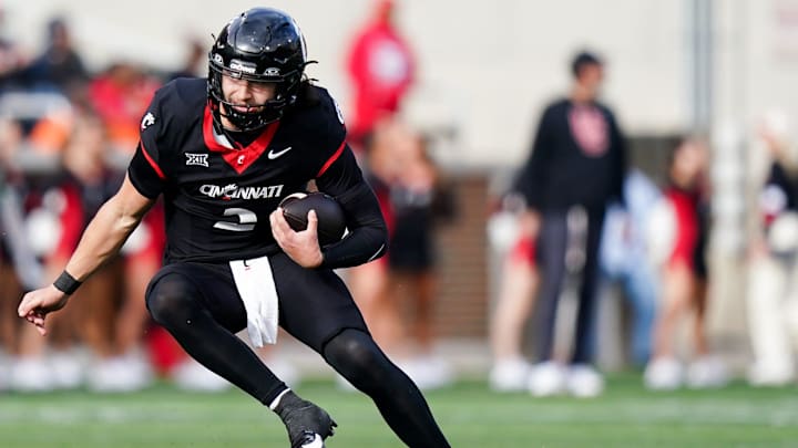 Cincinnati Bearcats quarterback Brendan Sorsby (2) runs down the field with the ball in the fourth quarter of a college football game between the Cincinnati Bearcats and West Virginia Mountaineers, Saturday, Nov. 9, 2024, at Nippert Stadium in Cincinnati. Mountaineers won 31-24.