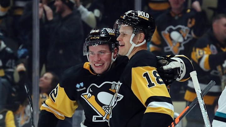 Nov 16, 2024; Pittsburgh, Pennsylvania, USA;  Pittsburgh Penguins right wing Jesse Puljujarvi (18) celebrates with right wing Sam Poulin (22) after scoring a goal against the San Jose Sharks during the first period at PPG Paints Arena. Mandatory Credit: Charles LeClaire-Imagn Images