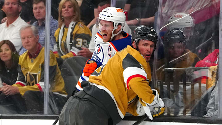 May 6, 2025; Las Vegas, Nevada, USA; Vegas Golden Knights defenseman Brayden McNabb (3) checks Edmonton Oilers center Connor McDavid (97) during the first period of game one of the second round of the 2025 Stanley Cup Playoffs at T-Mobile Arena. Mandatory Credit: Stephen R. Sylvanie-Imagn Images