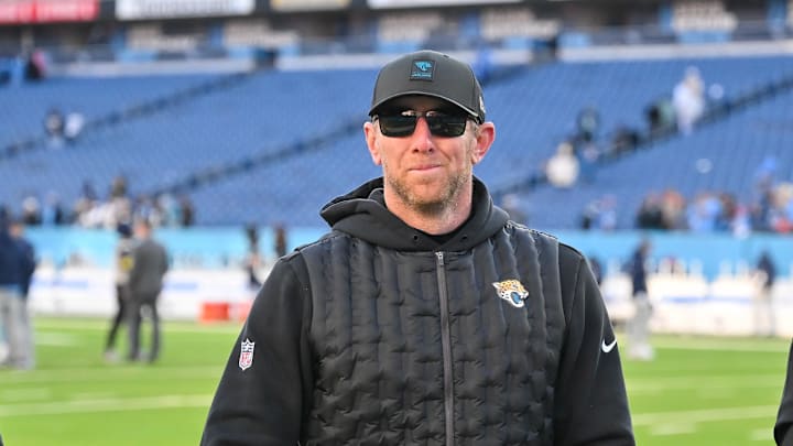 Nov 30, 2025; Nashville, Tennessee, USA;  Jacksonville Jaguars head coach Liam Coen smiles to the crowd as he walks of the field against the Tennessee Titans during the second half at Nissan Stadium. Mandatory Credit: Steve Roberts-Imagn Images