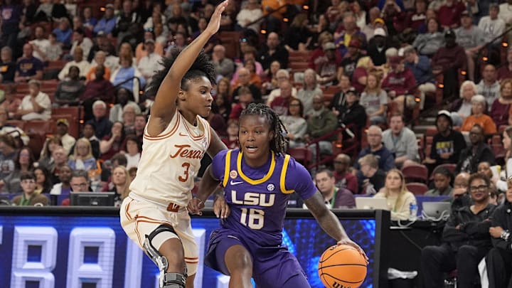 Mar 8, 2025; Greenville, SC, USA; LSU Lady Tigers guard Kailyn Gilbert (16) drives to the basket against Texas Longhorns guard Rori Harmon (3) during the first half at Bon Secours Wellness Arena. Mandatory Credit: Jim Dedmon-Imagn Images