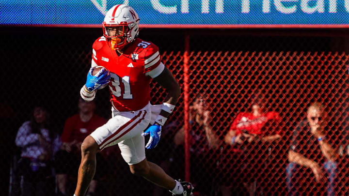 Nebraska Cornhuskers defensive back Tommi Hill (31) returns an interception.
