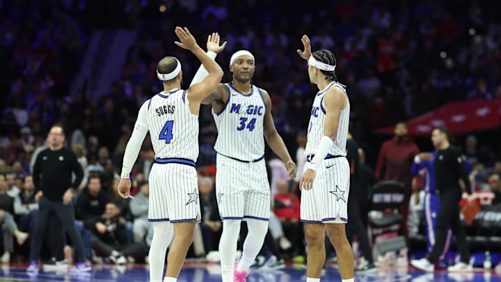 Nov 25, 2025; Philadelphia, Pennsylvania, USA; Orlando Magic guard Anthony Black (0) and center Wendell Carter Jr. (34) and guard Jalen Suggs (4) high five after a play against the Philadelphia 76ers during the second quarter at Xfinity Mobile Arena. Mandatory Credit: Bill Streicher-Imagn Images