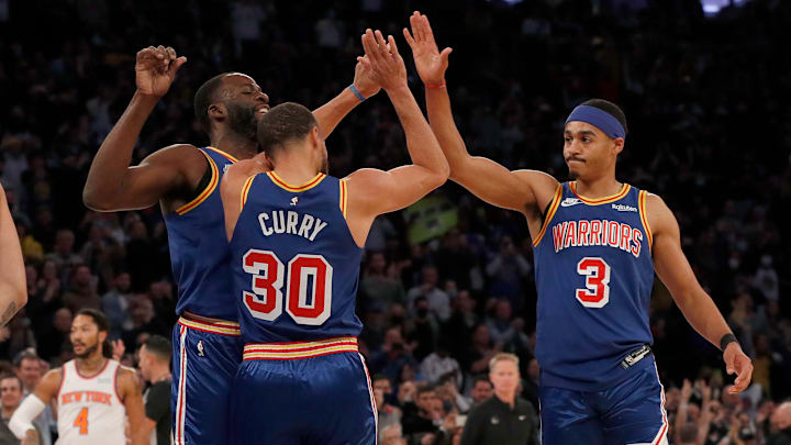 Stephen Curry, Draymond Green and Jordan Poole.