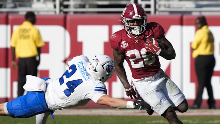 Nov 22, 2025; Tuscaloosa, Alabama, USA;  Alabama running back Jam Miller (26) eludes Eastern Illinois safety Nick Vecchiarelli (24) as he runs the ball at Saban Field at Bryant-Denny Stadium. Mandatory Credit: Gary Cosby Jr.-Imagn Images