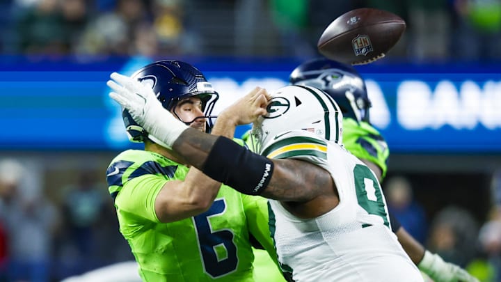 Dec 15, 2024; Seattle, Washington, USA; Green Bay Packers defensive tackle Kenny Clark (97) pressures Seattle Seahawks quarterback Sam Howell (6) during fourth quarter at Lumen Field. Mandatory Credit: Joe Nicholson-Imagn Images Dec 15, 2024; Seattle, Washington, USA; Green Bay Packers defensive tackle Kenny Clark (97) pressures Seattle Seahawks quarterback Sam Howell (6) during fourth quarter at Lumen Field. Mandatory Credit: Joe Nicholson-Imagn Images