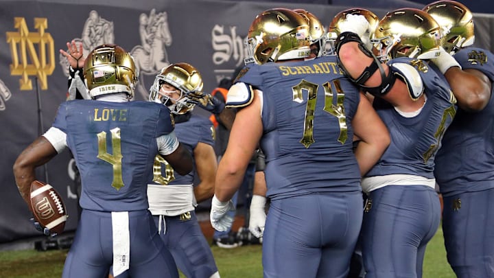 Nov 23, 2024; New York, New York, USA; Notre Dame Fighting Irish running back Jeremiyah Love (4) celebrates a touchdown against the Army Black Knights during the first half at Yankee Stadium. 