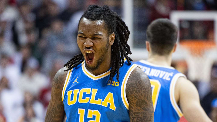 Feb 14, 2025; Bloomington, Indiana, USA; UCLA Bruins guard Sebastian Mack (12) reacts to made basket in the first half against the Indiana Hoosiers at Simon Skjodt Assembly Hall. Mandatory Credit: Trevor Ruszkowski-Imagn Images