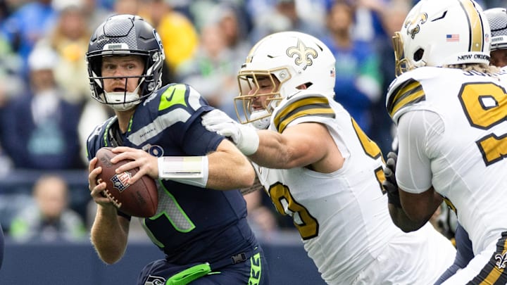 Sep 21, 2025; Seattle, Washington, USA; Seattle Seahawks quarterback Sam Darnold (14) is pressured by New Orleans Saints defensive tackle Bryan Bresee (90) during the first half at Lumen Field. Mandatory Credit: Joe Nicholson-Imagn Images Sep 21, 2025; Seattle, Washington, USA; Seattle Seahawks quarterback Sam Darnold (14) is pressured by New Orleans Saints defensive tackle Bryan Bresee (90) during the first half at Lumen Field. Mandatory Credit: Joe Nicholson-Imagn Images