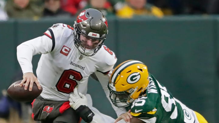 Green Bay Packers defensive tackle Devonte Wyatt (95) chases Tampa Bay Buccaneers quarterback Baker