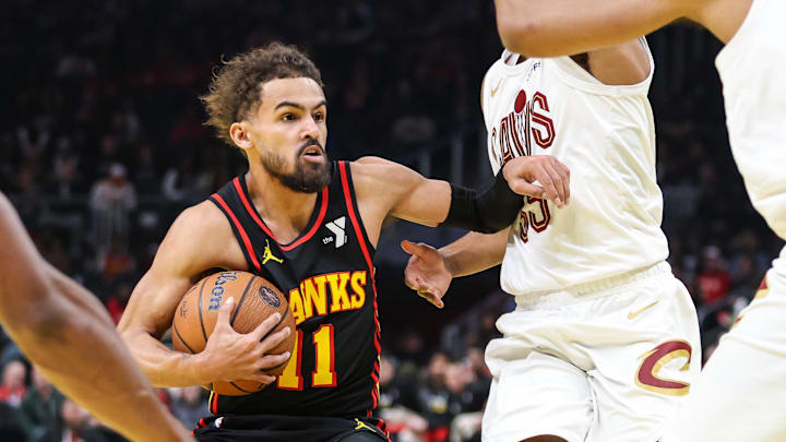 Nov 29, 2024; Atlanta, Georgia, USA; Atlanta Hawks guard Trae Young (11) protects the ball against the Cleveland Cavaliers during the first quarter at State Farm Arena. Mandatory Credit: Jordan Godfree-Imagn Images