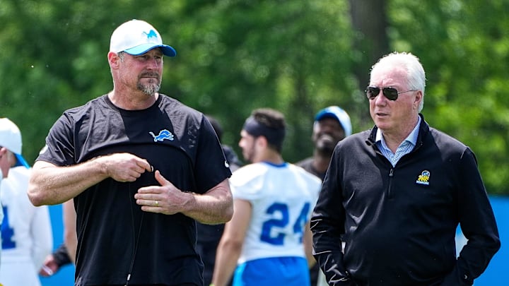 Detroit Lions head coach Dan Campbell, left, talks to president Rod Wood after practice during OTA at Meijer Performance Center in Allen Park on Friday, May 30, 2025.