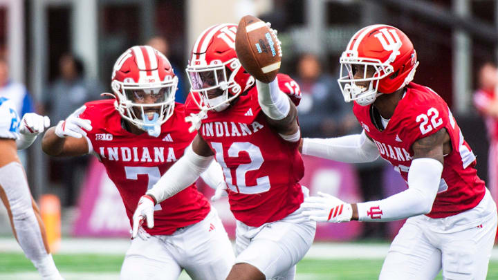 Indiana's Louis Moore (7), Devan Boykin (12), and Jamari Sharpe (22) celebrate Boykin's interception during the Indiana versus UCLA football game at Memorial Stadium on Saturday, Oct. 25, 2025. Indiana's Louis Moore (7), Devan Boykin (12), and Jamari Sharpe (22) celebrate Boykin's interception during the Indiana versus UCLA football game at Memorial Stadium on Saturday, Oct. 25, 2025.