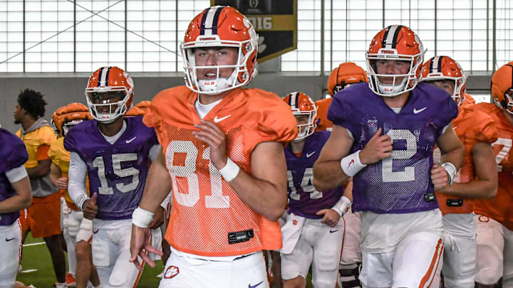 Clemson kicker Nolan Hauser (81) runs with teammates including quarterback Cade Klubnik (2) to the outdoor fields during Spring Practice in Clemson, S.C. Monday, March 24, 2025.