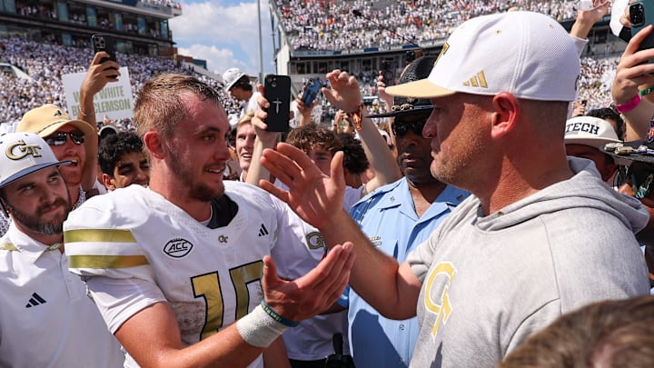 Sep 13, 2025; Atlanta, Georgia, USA; Georgia Tech Yellow Jackets quarterback Haynes King (10) and head coach Brent Key celebrate after a victory over the Clemson Tigers at Bobby Dodd Stadium at Hyundai Field. Mandatory Credit: Brett Davis-Imagn Images