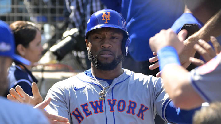Oct 14, 2024; Los Angeles, California, USA; New York Mets outfielder Starling Marte (6) celebrates in the dugout after scoring on a double by outfielder Tyrone Taylor (not pictured) in the second inning against the Los Angeles Dodgers during game two of the NLCS for the 2024 MLB Playoffs at Dodger Stadium. Mandatory Credit: Jayne Kamin-Oncea-Imagn Images Oct 14, 2024; Los Angeles, California, USA; New York Mets outfielder Starling Marte (6) celebrates in the dugout after scoring on a double by outfielder Tyrone Taylor (not pictured) in the second inning against the Los Angeles Dodgers during game two of the NLCS for the 2024 MLB Playoffs at Dodger Stadium. Mandatory Credit: Jayne Kamin-Oncea-Imagn Images