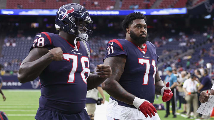 Aug 13, 2022; Houston, Texas, USA; Houston Texans offensive tackle Laremy Tunsil (78) and offensive tackle Tytus Howard (71) walk off the field before the game against the New Orleans Saints at NRG Stadium. Mandatory Credit: Troy Taormina-USA TODAY Sports