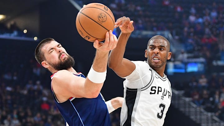 Nov 4, 2024; Inglewood, California, USA; San Antonio Spurs guard Chris Paul (3) plays for the ball against Los Angeles Clippers center Ivica Zubac (40) during the first half at Intuit Dome. Mandatory Credit: Gary A. Vasquez-Imagn Images Nov 4, 2024; Inglewood, California, USA; San Antonio Spurs guard Chris Paul (3) plays for the ball against Los Angeles Clippers center Ivica Zubac (40) during the first half at Intuit Dome. Mandatory Credit: Gary A. Vasquez-Imagn Images