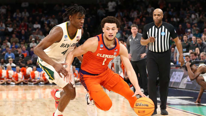 Mar 24, 2024; Memphis, TN, USA; Clemson Tigers guard Chase Hunter (1) controls the ball against Baylor Bears guard Ja'Kobe Walter (4) in the first half in the second round of the 2024 NCAA Tournament at FedExForum. Mandatory Credit: Petre Thomas-USA TODAY Sports Mar 24, 2024; Memphis, TN, USA; Clemson Tigers guard Chase Hunter (1) controls the ball against Baylor Bears guard Ja'Kobe Walter (4) in the first half in the second round of the 2024 NCAA Tournament at FedExForum. Mandatory Credit: Petre Thomas-USA TODAY Sports