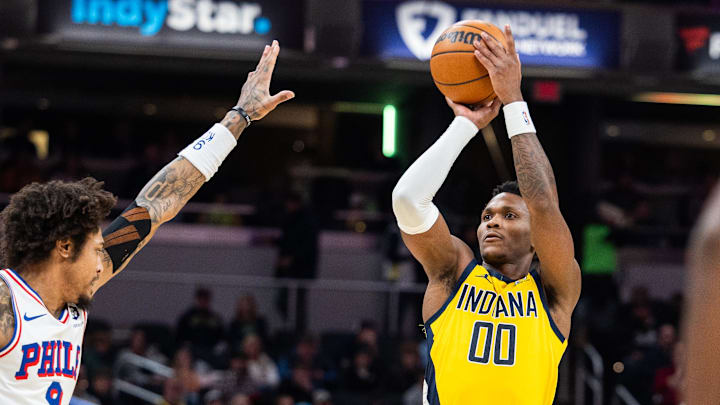 Jan 18, 2025; Indianapolis, Indiana, USA; Indiana Pacers guard Bennedict Mathurin (00) shoots the ball while Philadelphia 76ers guard Kelly Oubre Jr. (9) defends in the first half at Gainbridge Fieldhouse. Mandatory Credit: Trevor Ruszkowski-Imagn Images Jan 18, 2025; Indianapolis, Indiana, USA; Indiana Pacers guard Bennedict Mathurin (00) shoots the ball while Philadelphia 76ers guard Kelly Oubre Jr. (9) defends in the first half at Gainbridge Fieldhouse. Mandatory Credit: Trevor Ruszkowski-Imagn Images