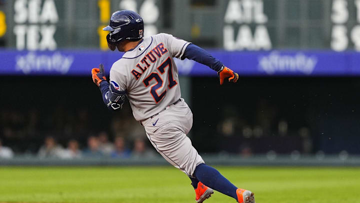 Houston Astros second baseman Jose Altuve (27) rounds first base for a double in the first inning. 