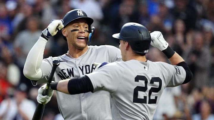 May 23, 2025; Denver, Colorado, USA; New York Yankees right fielder Aaron Judge (99) celebrates his solo home run with designated hitter Ben Rice (22) in the fifth inning against the Colorado Rockies at Coors Field. Mandatory Credit: Ron Chenoy-Imagn Images