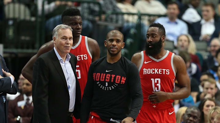 Jan 24, 2018; Dallas, TX, USA; Houston Rockets guard Chris Paul (center) head coach Mike D'Antoni center Clint Capela (15) and guard James Harden look on during a break in the action from the game against the Dallas Mavericks at American Airlines Center. Mandatory Credit: Matthew Emmons-Imagn Images