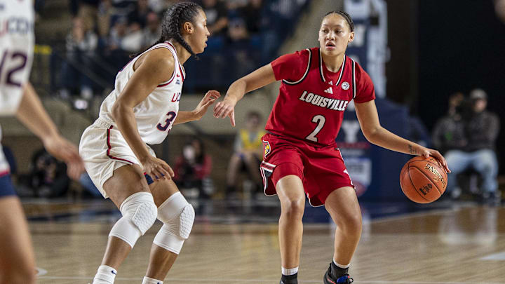 Nov 4, 2025; Annapolis, Maryland, USA  Louisville Cardinals guard Imari Berry (2) dribbles as UConn Huskies guard Azzi Fudd (35) defends during the first half at Alumni Hall on United States Naval Academy. Mandatory Credit: Tommy Gilligan-Imagn Images