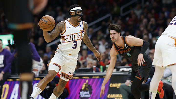 Feb 4, 2024; Washington, District of Columbia, USA; Phoenix Suns guard Bradley Beal (3) drives to the basket past Washington Wizards forward Deni Avdija (8) in the first half at Capital One Arena. Mandatory Credit: Geoff Burke-Imagn Images