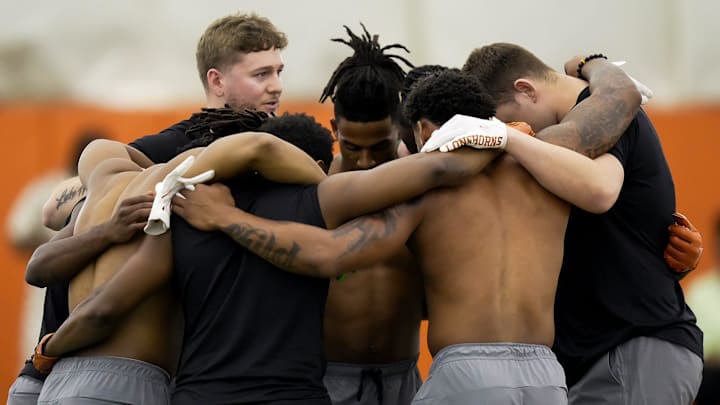 Former Longhorns Quinn Ewers gathers with his former teammates before the passing drill during the Texas' Pro Day at the Texas Football Training Facility on Tuesday, March 25, 2025.