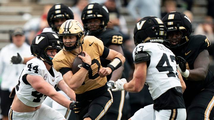 Vanderbilt quarterback Whit Muschamp (10) runs against Vanderbilt linebacker Daniel Vollmer Jr. (44) and linebacker Luke D'Alise (43) during Vanderbilt Football's Black and Gold Spring Game in FirstBank Stadium at Vanderbilt University Saturday, April 18, 2026. Vanderbilt quarterback Whit Muschamp (10) runs against Vanderbilt linebacker Daniel Vollmer Jr. (44) and linebacker Luke D'Alise (43) during Vanderbilt Football's Black and Gold Spring Game in FirstBank Stadium at Vanderbilt University Saturday, April 18, 2026.