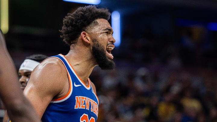 Nov 10, 2024; Indianapolis, Indiana, USA; New York Knicks center Karl-Anthony Towns (32) reacts to an and one basket in the second half against the Indiana Pacers at Gainbridge Fieldhouse. Mandatory Credit: Trevor Ruszkowski-Imagn Images