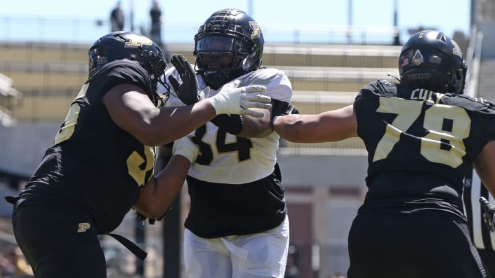 Purdue Boilermakers offensive linemen DJ Wingfield (55) and Bakyne Coly (78) block Damarjhe Lewis Purdue Boilermakers offensive linemen DJ Wingfield (55) and Bakyne Coly (78) block Damarjhe Lewis
