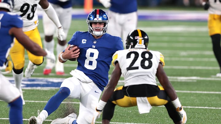 Sep 14, 2020; East Rutherford, New Jersey, USA; New York Giants quarterback Daniel Jones (8) slides as Pittsburgh Steelers cornerback Mike Hilton (28) defends during the second half at MetLife Stadium. Sep 14, 2020; East Rutherford, New Jersey, USA; New York Giants quarterback Daniel Jones (8) slides as Pittsburgh Steelers cornerback Mike Hilton (28) defends during the second half at MetLife Stadium.