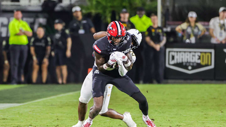 Aug 28, 2025; Orlando, Florida, USA; Jacksonville State Gamecocks wide receiver Deondre Johnson (11) is tackled by UCF Knights defensive back Jayden Bellamy (29) during the second quarter at Acrisure Bounce House. Mandatory Credit: Mike Watters-Imagn Images