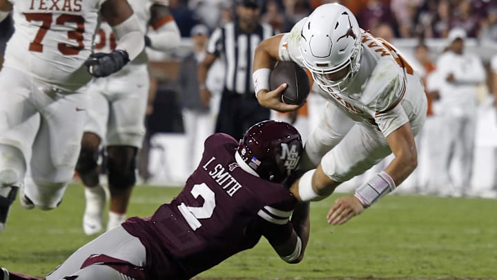 Oct 25, 2025; Starkville, Mississippi, USA; Texas Longhorns quarterback Arch Manning (16) runs the ball as Mississippi State Bulldogs defensive back Isaac Smith (2) makes the tackle during overtime at Davis Wade Stadium at Scott Field. Mandatory Credit: Petre Thomas-Imagn Images Oct 25, 2025; Starkville, Mississippi, USA; Texas Longhorns quarterback Arch Manning (16) runs the ball as Mississippi State Bulldogs defensive back Isaac Smith (2) makes the tackle during overtime at Davis Wade Stadium at Scott Field. Mandatory Credit: Petre Thomas-Imagn Images